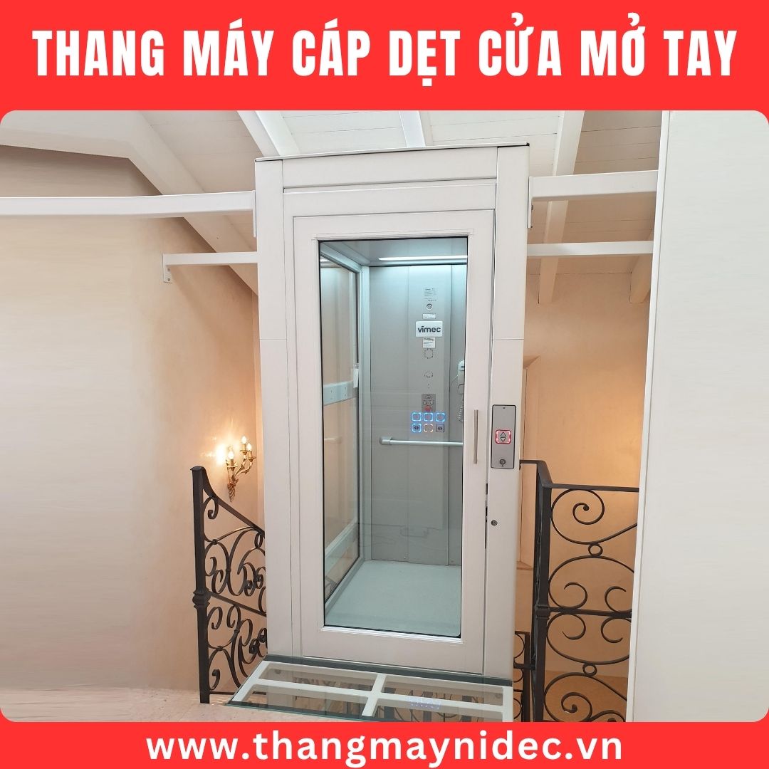 thang máy cáp dẹt cửa mở tay